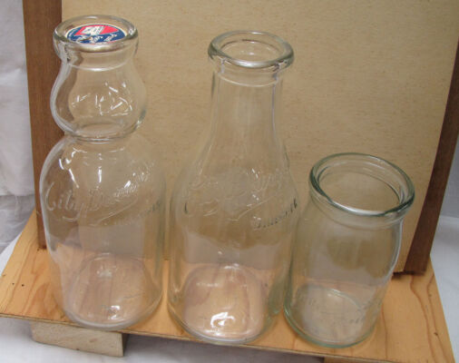 3 embossed bottles City Dairy – Winnipeg Cream top QT, standard QT, PT sour cream bottle.