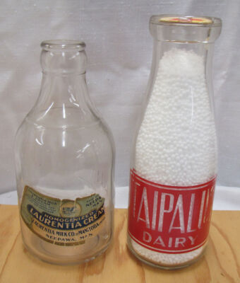 On the left: Laurentia Milk Co. PT, Nepawa, Man. Note paper label!
On the right: Taipalus Dairy Pt – Red a.c.l.